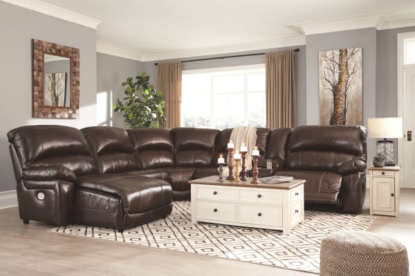 Hallstrung - Chocolate - 9 Pc. - Left Arm Facing Press Back Power Chaise, Armless Chair, Wedge, Armless Recliner, Console with Storage, Right Arm Facing Zero Wall Power Recliner Sectional, Bolanburg Cocktail Table, 2 Chair Side End Tables