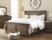 Flynnter - Medium Brown - 5 Pc. - Dresser, Mirror, California King Panel Bed