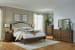 Sturlayne - Brown - 7 Pc. - Dresser, Mirror, King Upholstered Panel Bed, 2 Nightstands