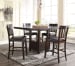 Haddigan - Dark Brown - 5 Pc. - Counter Extension Table, 4 Barstools