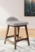 Lyncott - Light Gray / Brown - 5 Pc. - Counter Table, 4 Upholstered Barstools
