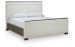 Radkin - California King Upholstered Panel Bed - Burnished Brown