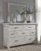 Brashland - White - 7 Pc. - Dresser, Mirror, California King Panel Bed With Bench Footboard, 2 Nightstands