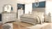 Realyn - Two-tone - 5 Pc. - Dresser, Mirror, King Upholstered Sleigh Bed