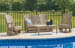 Hyland Wave - Driftwood - 4 Pc. - Glider Loveseat, 2 Swivel Glider Chairs, Cocktail Table