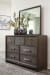 Brueban - Rich Brown - 8 Pc. - Dresser, Mirror, Chest, California King Panel Bed with 2 Storage Drawers, 2 Nightstands