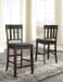 Haddigan - Dark Brown - 5 Pc. - Counter Extension Table, 4 Barstools
