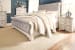 Realyn - Two-tone - 6 Pc. - Dresser, Mirror, Chest, California King Upholstered Sleigh Bed