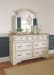 Realyn - Two-tone - 6 Pc. - Dresser, Mirror, Chest, King Upholstered Sleigh Bed