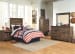 Trinell - Brown - 3 Pc. - Dresser, Mirror, Twin Panel Headboard