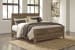 Trinell - Brown - King Panel Bed