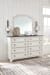 Nashbryn - Whitewash - 8 Pc. - Dresser, Mirror, Chest, California King Panel Bed, 2 Nightstands