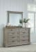 Moreshire - Bisque - 7 Pc. - Dresser, Mirror, King Panel Bed, 2 Nightstands