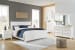 Fortman - 8 Pc. - Dresser, Mirror, Chest, King Panel Bed, 2 Nightstands - White