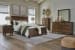 Danabrin - 7 Pc. - Dresser, Mirror, Queen Panel Bed, 2 Nightstands - Brown
